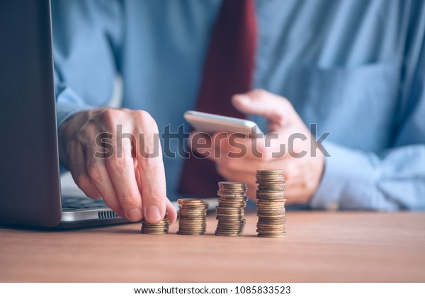 finances budgeting businessman stacking coins on royalty finances budgeting