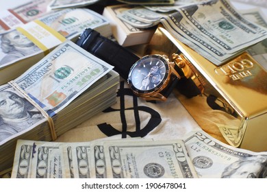 Financial Abundance  Affluence With Stacks Of Cash With Luxury Watch  Gold Bar  - Shutterstock ID 1906478041