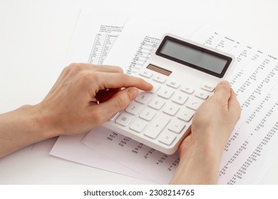 Financial accounting and report preparing with calculator on office table. - Shutterstock ID 2308214765