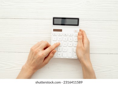 Financial accounting work with calculator. Business report preparing. - Shutterstock ID 2316411589