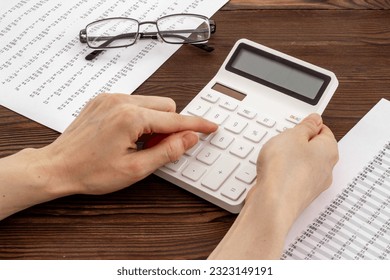 Financial accounting work with calculator. Business planning concept. - Shutterstock ID 2323149191