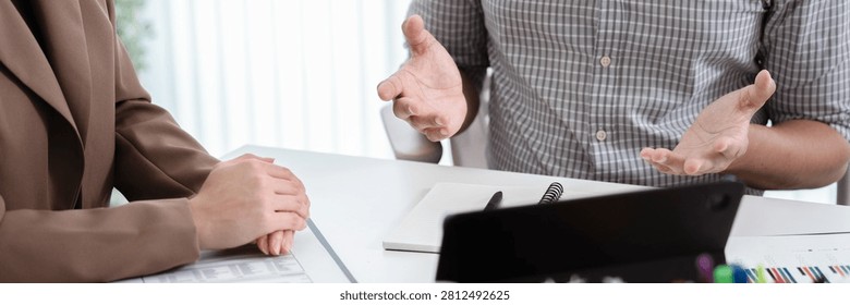 Financial admin reviewing data at worktable in professional office