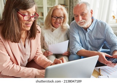 Financial Adviser Or Senior Counselor On Laptop Pc In A Home Consultation For Seniors