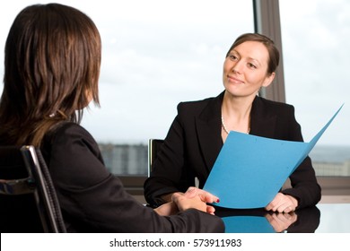 Financial Adviser Talking With A Client In Bank Building
