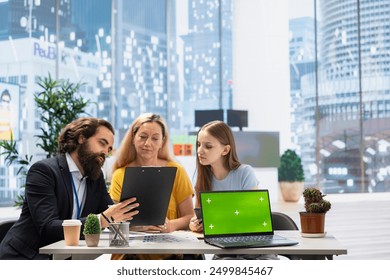 Financial advisor uses isolated screen laptop and tablet to help clients manage diversified investment portfolio. Agent uses chroma key notebook to provide family mix of stocks, bonds and other assets - Powered by Shutterstock