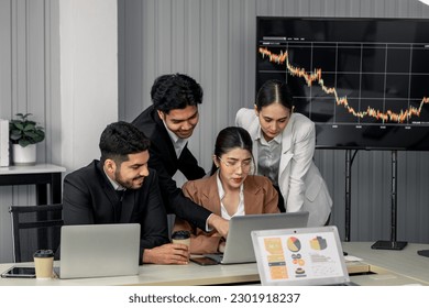 Financial advisors collaborate to assess a company's financial performance using data from its operational activities. Team members work together in a discussions meeting to develop a business plan. - Powered by Shutterstock