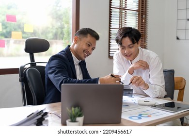 Financial advisory concept. Asian advisor showing plan of investment to clients in the consultancy office. - Shutterstock ID 2209456617