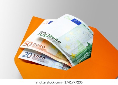 Financial Aid: 20, 50, 100, and 500 Euro Banknotes in Yellow Envelope 