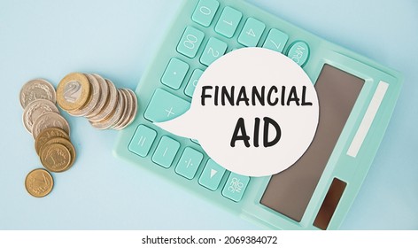 Financial Aid - Text Written On A Notebook With Office Background