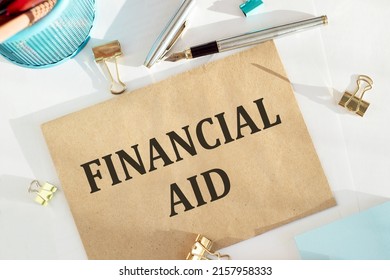 FINANCIAL AID Written Onenvelope On Office Wooden Table. Business Concept