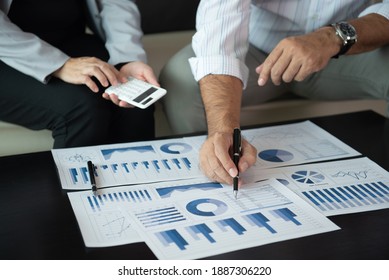 Financial analyst analysis business financial report and discussion at meeting of corporate showing the results of their successful teamwork. - Shutterstock ID 1887306220