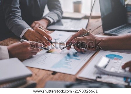 Financial analyst analyzes businessman investment consultant analyzing company financial report balance sheet statement working with documents graphs. Concept picture for stock market, office, tax