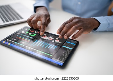 Financial Analyst Using Analytics Technology On Tablet