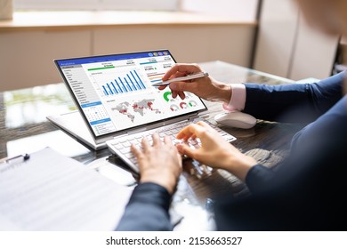 Financial Analyst Using Convertible Laptop Screen With Graphs - Shutterstock ID 2153663527