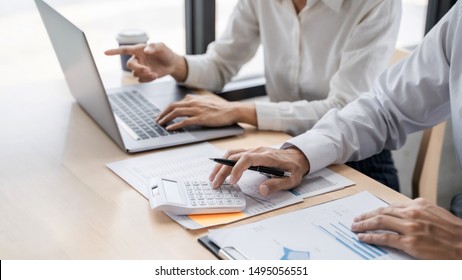 Financial analyst using laptop calculating numbers in office. - Shutterstock ID 1495056551