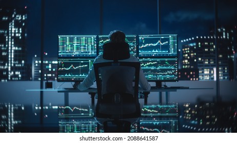 Financial Analyst Working Computer and Multi  Monitor Workstation and Real  Time Stocks  Commodities   Exchange Market Charts  Businessman Deliberating Next Investment Trade in Bank Office 