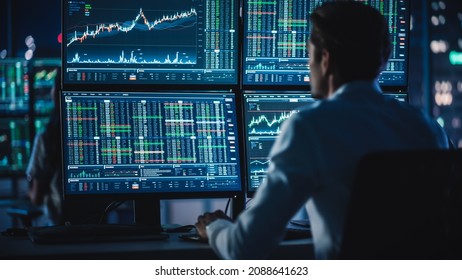 Financial Analysts   Day Traders Working Computers and Multi  Monitor Workstations and Real  Time Stocks  Commodities   Exchange Market Charts  Team Brokers at Work in Agency 