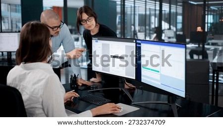 Financial Analysts Using Computer Software To Track And Monitor Budgets.