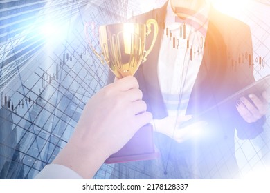 Financial Award, Professional Leadership, Best Entrepreneur, Business Cup In Hand On The Background Of Skyscrapers Offices