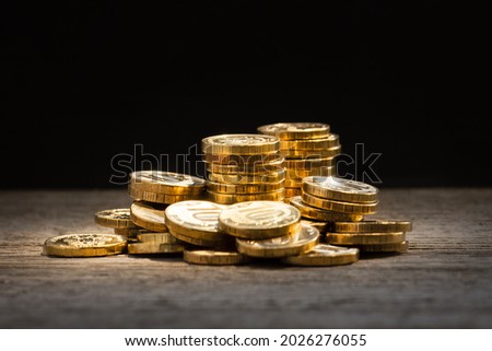 financial background, money, gold coins on a wooden table, the concept of investment, bank deposits, insurance, the work of a financial consultant