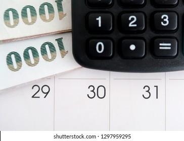 Financial Budget / Payment On Pay Day At The End Of The Month - With Calculator ,cash Money And Calendar On White Background.