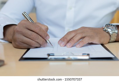 A Financial Businessman, A Young Man Analyzes Financial Data Using A Computer And Calculator To Compute And Summarize The Data In A Graph To Propose To The President.