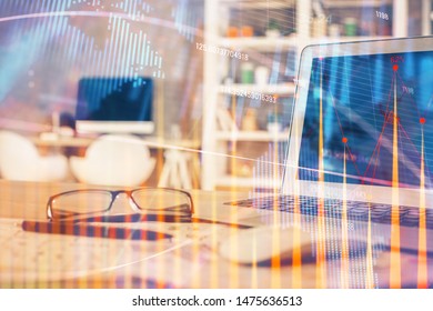 Financial chart drawing and table with computer on background. Double exposure. Concept of international markets.