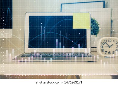 Financial chart drawing and table with computer on background. Double exposure. Concept of international markets.