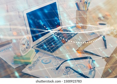 Financial chart drawing and table with computer on background. Multi exposure. Concept of international markets.