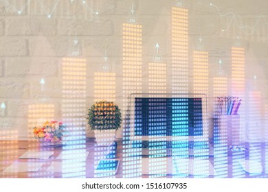 Financial chart drawing and table with computer on background. Double exposure. Concept of international markets.