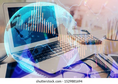 Financial chart drawing and table with computer on background. Double exposure. Concept of international markets.