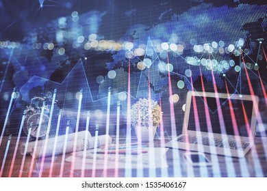 Financial chart drawing and table with computer on background. Double exposure. Concept of international markets.