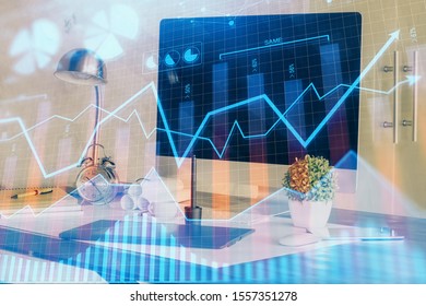 Financial chart drawing and table with computer on background. Double exposure. Concept of international markets.
