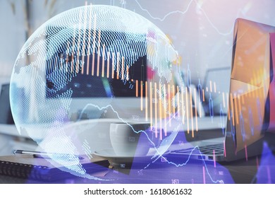 Financial chart drawing and table with computer on background. Double exposure. Concept of international markets.