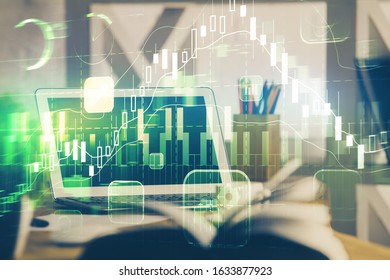 Financial chart drawing and table with computer on background. Multi exposure. Concept of international markets.