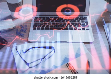 Financial chart drawing and table with computer on background. Double exposure. Concept of international markets.