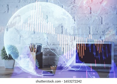 Financial chart drawing and table with computer on background. Multi exposure. Concept of international markets.