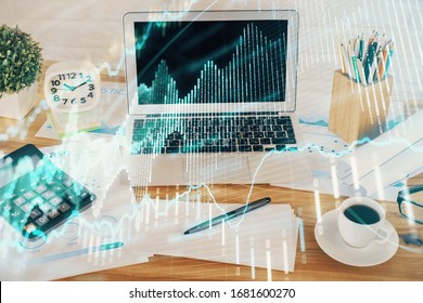 Financial chart drawing and table with computer on background. Multi exposure. Concept of international markets.