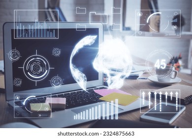 Financial chart drawing and table with computer on background. Multi exposure. Concept of international markets.