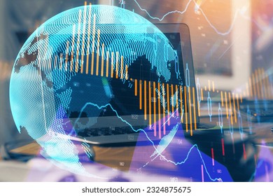 Financial chart drawing and table with computer on background. Double exposure. Concept of international markets.