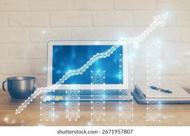 Financial chart drawing and table with computer on background. Multi exposure. Concept of international markets.