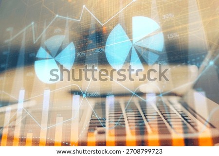 Financial chart drawing and table with computer on background. Multi exposure. Concept of international markets.