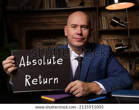 Financial concept about Absolute Return with sign on black notepad in hand.
