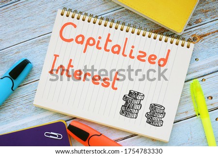 Financial concept about Capitalized Interest with sign on the piece of paper.