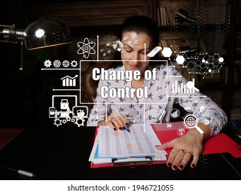 Financial Concept About Change Of Control With Inscription. Young Finance Market Analyst In Eyeglasses Working While Sitting At Wooden Table On Background.
