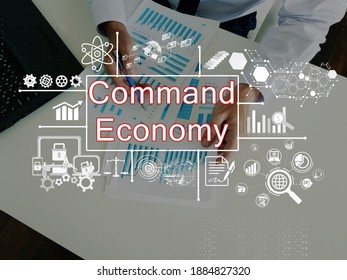  Financial Concept About Command Economy With Phrase On The Piece Of Paper.
