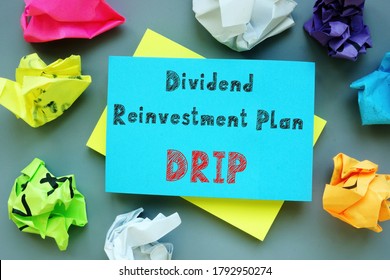 Financial concept about Dividend Reinvestment Plan DRIP with sign on the page.