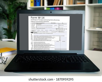  Financial Concept About  Form W-14 Certificate Of Foreign Contracting Party Receiving Federal Procurement Payments  With Inscription On The Sheet.
