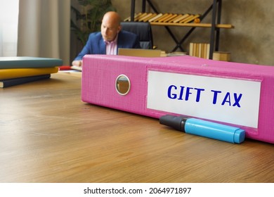 Financial concept about GIFT TAX with inscription on the File Folder.  - Shutterstock ID 2064971897