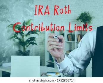 Financial Concept About IRA Roth Contribution Limits With Sign On The Piece Of Paper.